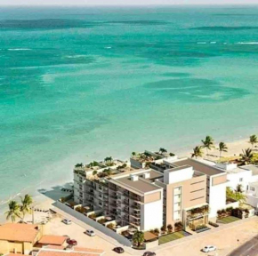 211B - Branco Haus, pé na areia e vista piscina